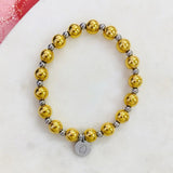 Pulsera elastica con bolitas en doradas medianas y bolitas plateadas pequeñas